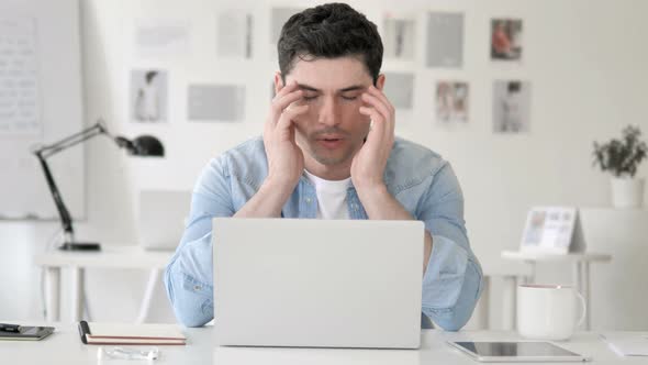 Casual Young Man with Headache