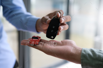 Close-up shot of exchanging car keys and model cars, Finance concept, Insurance, Car seizure. / Photodune, Misc
