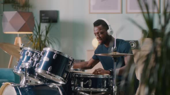 Black Drummer Playing Energetic Song