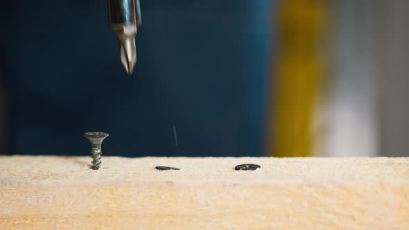 Man Builder Using Electric Screwdriver Closeup