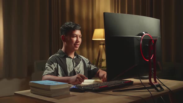 Asian Boy Student Distance Learning, Learn Online On Computer From Home
