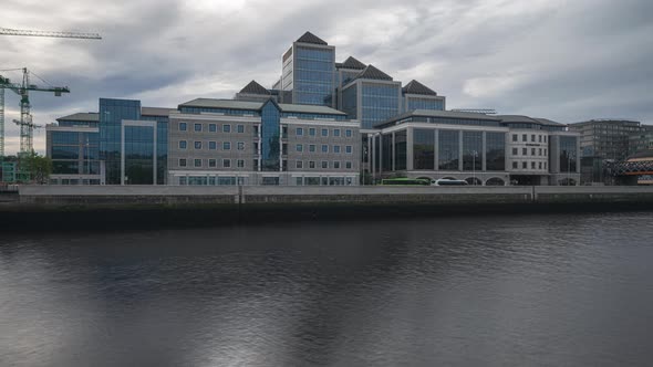 Panorama time lapse of daytime road traffic and people walking by in Dublin City in Ireland.