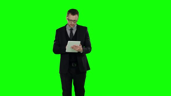 Business Man Makes Online Shopping . Green Screen.