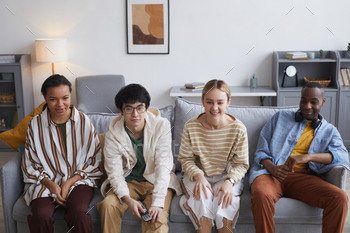 Young People Watching TV / Photodune, Misc