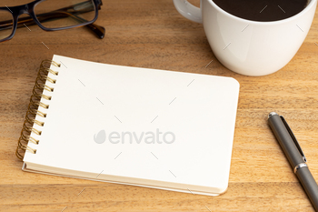 Spiral notepad mockup template on wooden desk / Photodune, Misc