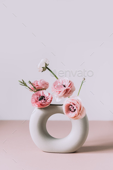 Tender ranunculus flowers in ceramic vase / Photodune, Misc