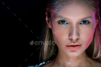 Close up portrait of sensual girl with creative winter make up isolated on black / Photodune, Misc