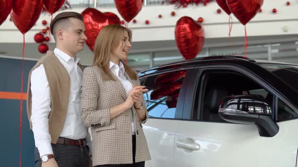 The Successful Husband Made a Gift to His Wife and Gave Her a Car and They Hug Themselves Together