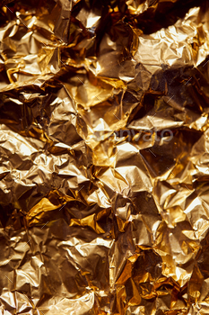 crumpled golden foil sheet with bright twinkles and shadows / Photodune, Misc