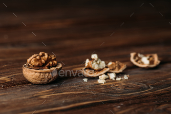 walnuts in nut shells as dementia symbol on wooden table / Photodune, Misc