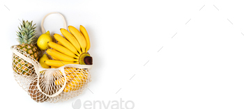 Shopping cotton bag with organic fruits banana, citrus, coconut and pineapple on white background / Photodune, Misc