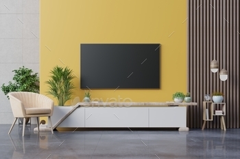 Living room led tv on yellow wall with armchair and cabinet tv on yellow wall background. / Photodune, Misc