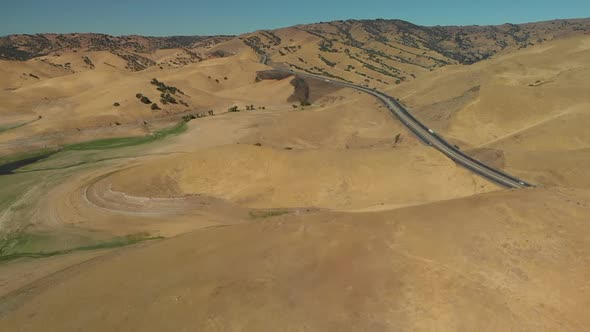 Aerial of San Luis Reservoir Hills During Midday