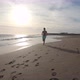 One young man running and enjoying summer in a beach alone with sunset - VideoHive Item for Sale