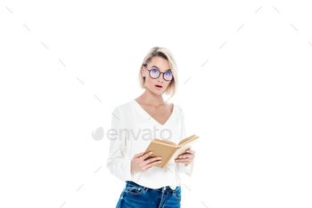 beautiful surprised student in eyeglasses reading book, isolated on white / Photodune, Misc