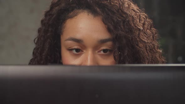 Half Face Portrait of Woman Working on Laptop