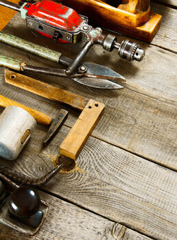 Many working tools on a wooden background. / Photodune, Misc