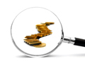 Gold coins and magnifier. On white background. - PhotoDune Item for Sale