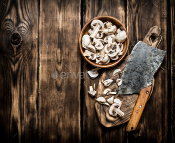Fresh mushrooms sliced big old hatchet. / Photodune, Misc