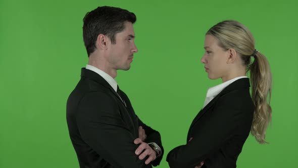 Professional Male and Female Looking at Each Other and Smiling, Chroma Key