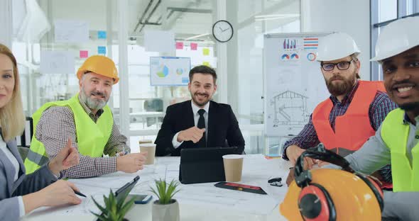 Professional Team of Engineers and Male and Female Managers which Posing on Camera