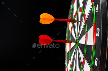 Dartboard on black dark background close up / Photodune, Misc
