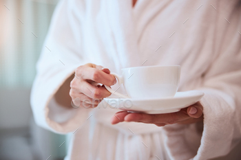 Young female with a cup of herbal beverage / Photodune, Misc