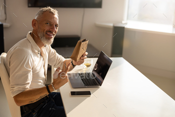 Proud man is displaying a tiny package / Photodune, Misc