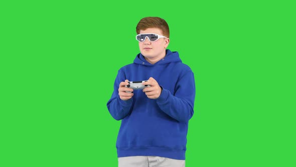 Teenager Boy Playing Video Game on a Green Screen Chroma Key