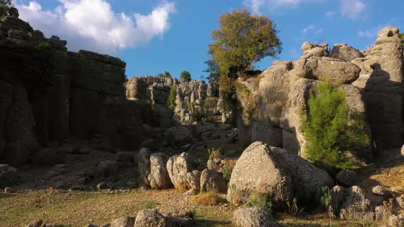 Landscape with Picturesque Rock Formations and Blue Sky in the Background