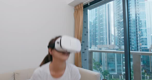 Woman Play Boxing Game and Wearing VR Device