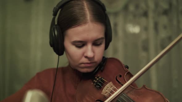Process of Rehearsing the Instrumental Melody with Violin By Female Musician
