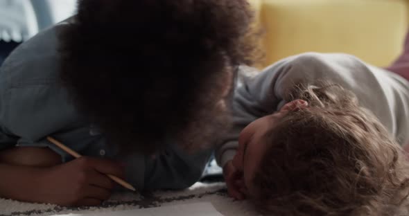 Mother Kissing Daughter on Floor