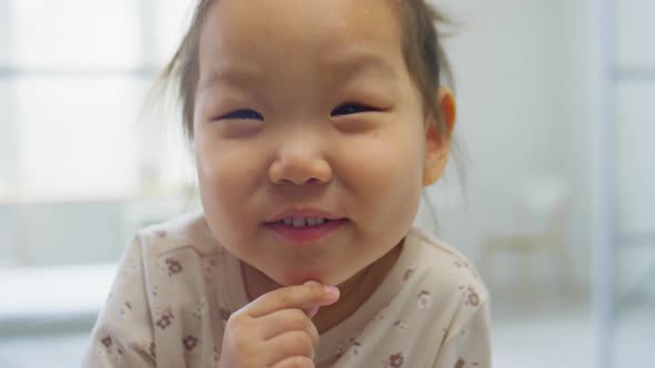 Portrait of Happy Asian Toddler Girl in Medical Office