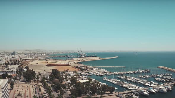 Drone View of City Port Pier with Modern White Yachts Sailboats in Seaside Larnaca Town