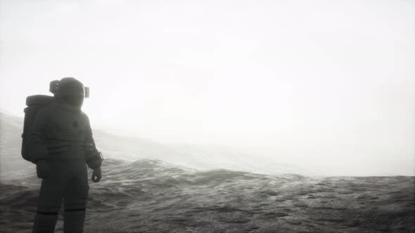 Astronaut on Another Planet with Dust and Fog alt