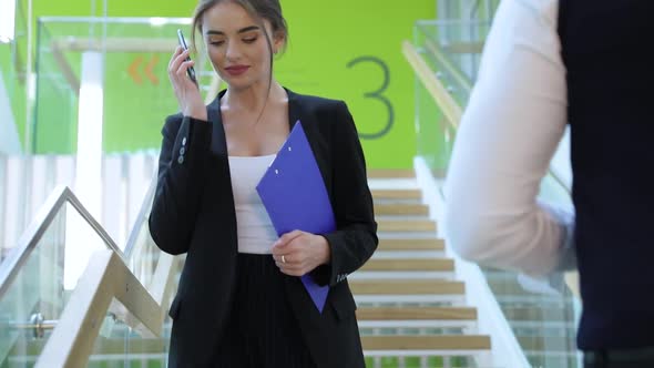 Business Center. Woman Talking On Phone In Office Building