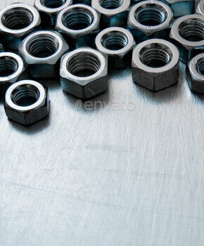 Nuts on scratched metal background. / Photodune, Misc