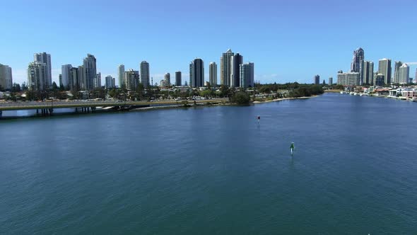 Stunning Surfers Paradise from the air, Descending shot ending with tree and foreshore.