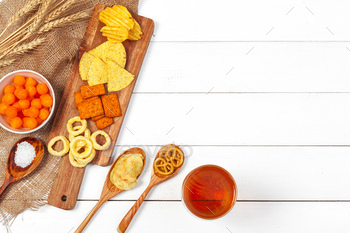 Lager beer and snacks on wooden table / Photodune, Misc