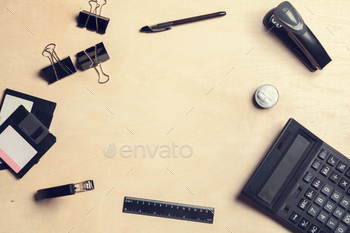 Overhead shot of a desk with various office tools, and calculator / Photodune, Misc