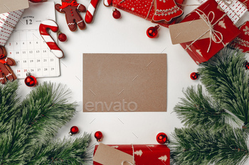 Christmas background with presents, coniferous branches and gingerbread cookie / Photodune, Misc