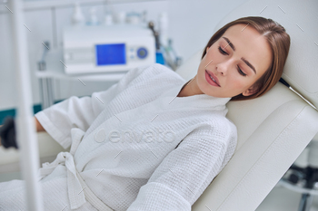 Charming Caucasian female during medical procedure in beauty clinic / Photodune, Misc