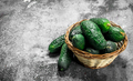 Fresh cucumbers in a basket. - PhotoDune Item for Sale