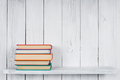 Books on a wooden shelf. - PhotoDune Item for Sale