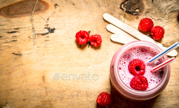 Berry smoothie raspberry with wooden sticks. / Photodune, Misc