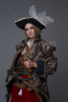 Woman corsair captain with hat and handgun / Photodune, Misc