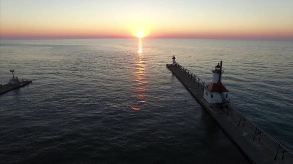 Sunset behind St. Joseph lighthouse on Lake Michigan