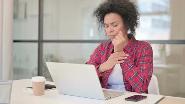 African Woman Having Wrist Pain While Using Laptop