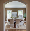 Elegant dining room through curved arch doorway - PhotoDune Item for Sale
